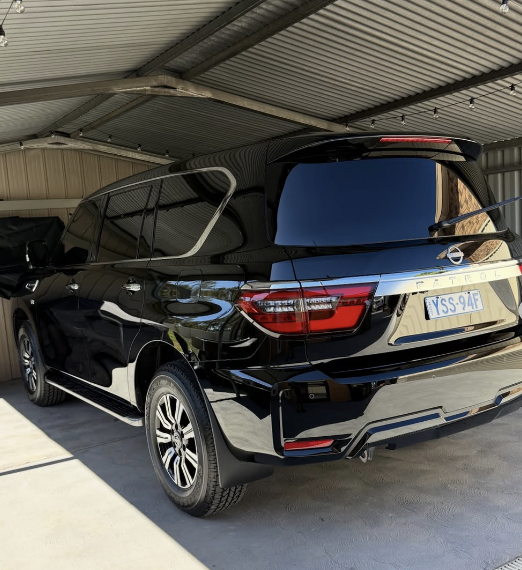 Black Nissan Patrol after paint correction, mirror-like reflection