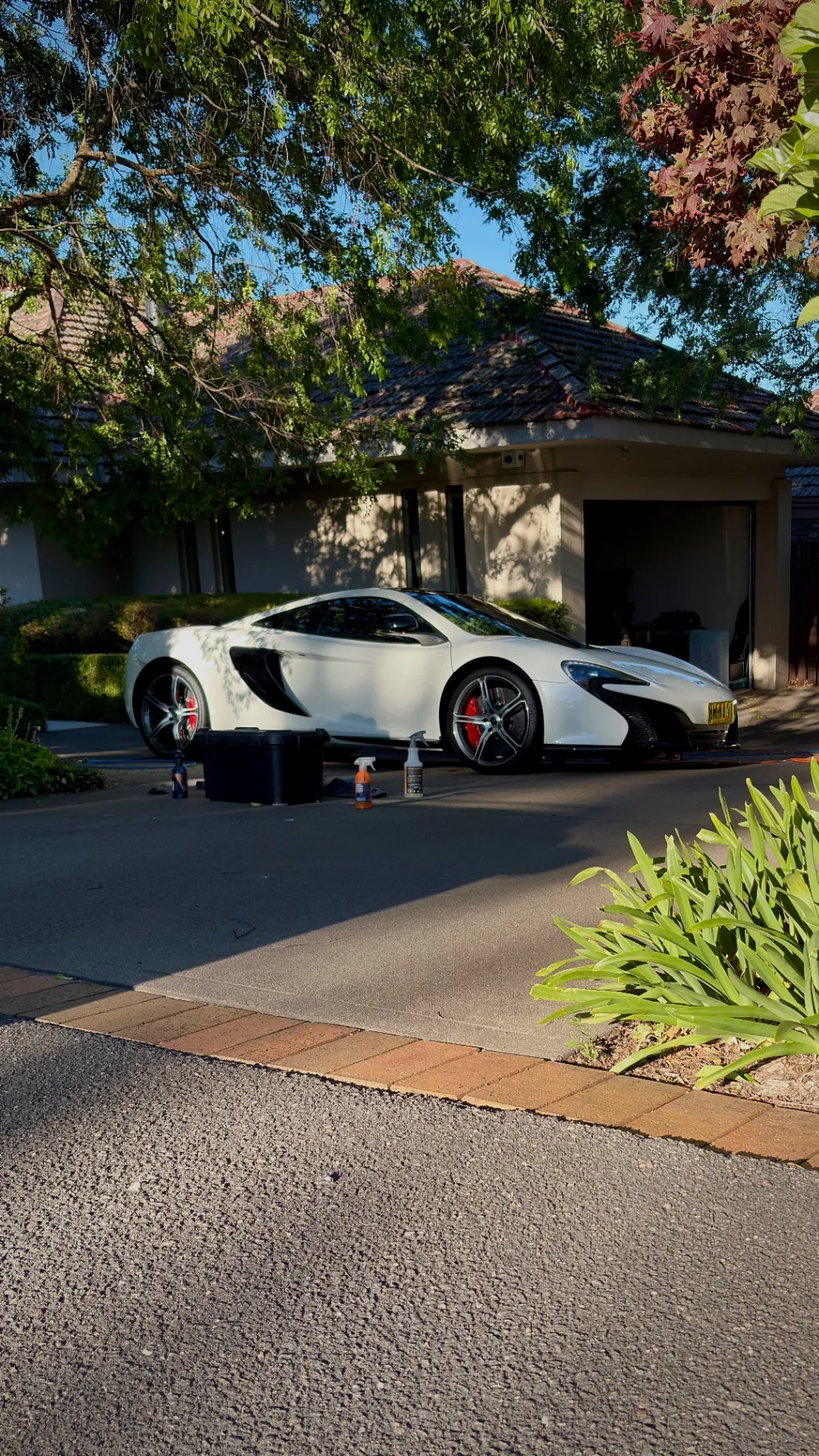 White McLaren 650S after a full detail in a Canberra driveway